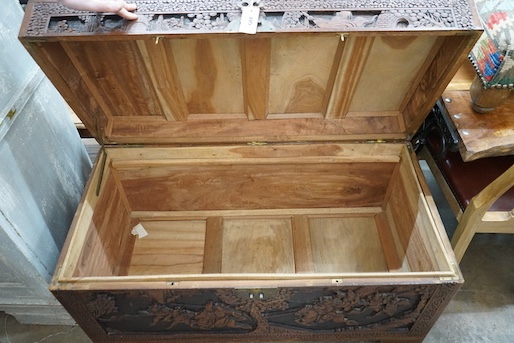 A Chinese carved camphorwood coffer, length 103cm, depth 52cm, height 59cm